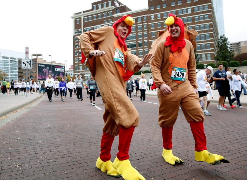 Eric Carlson (left) dances to music while walking with his friend Turner Vonalman at the...