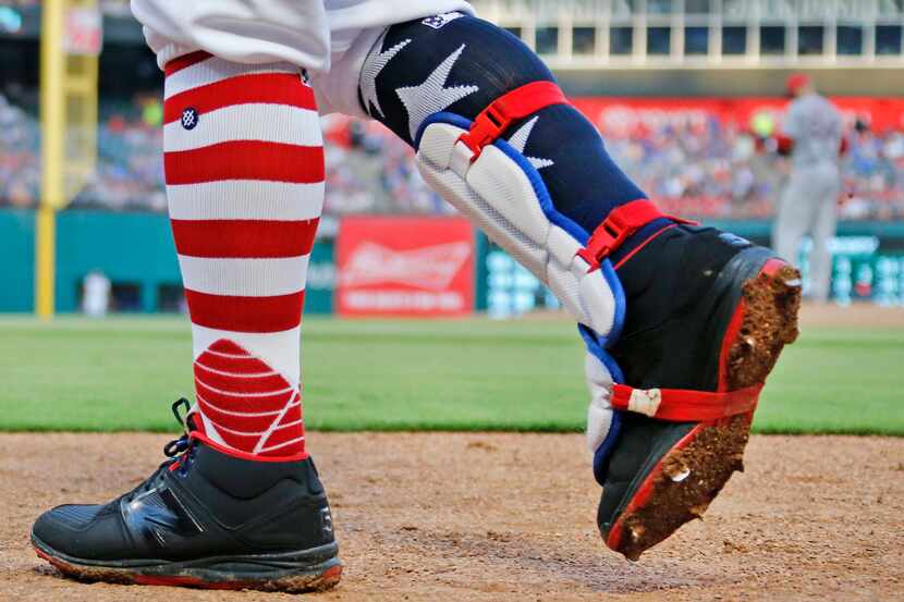 FILE - Rangers second baseman Rougned Odor (12) sports patriotic socks during a game against...