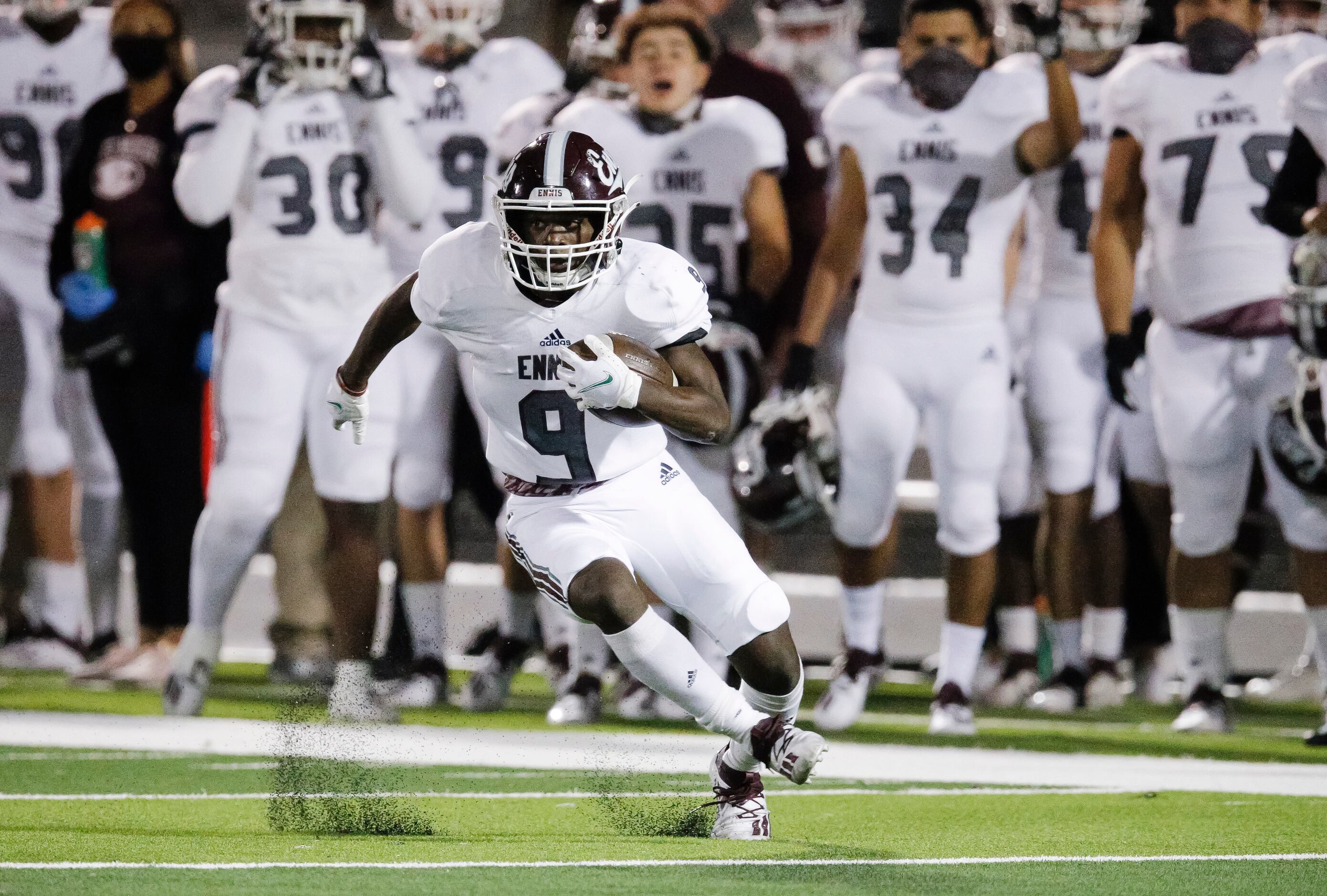 Ennis junior wide receiver Devion Beasley looks for room against the North Forney defense...