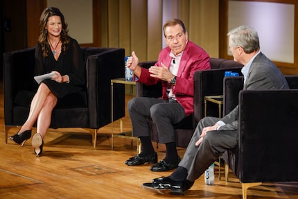 Heather Dinich, ESPN college football writer (from left), moderated a panel with former...