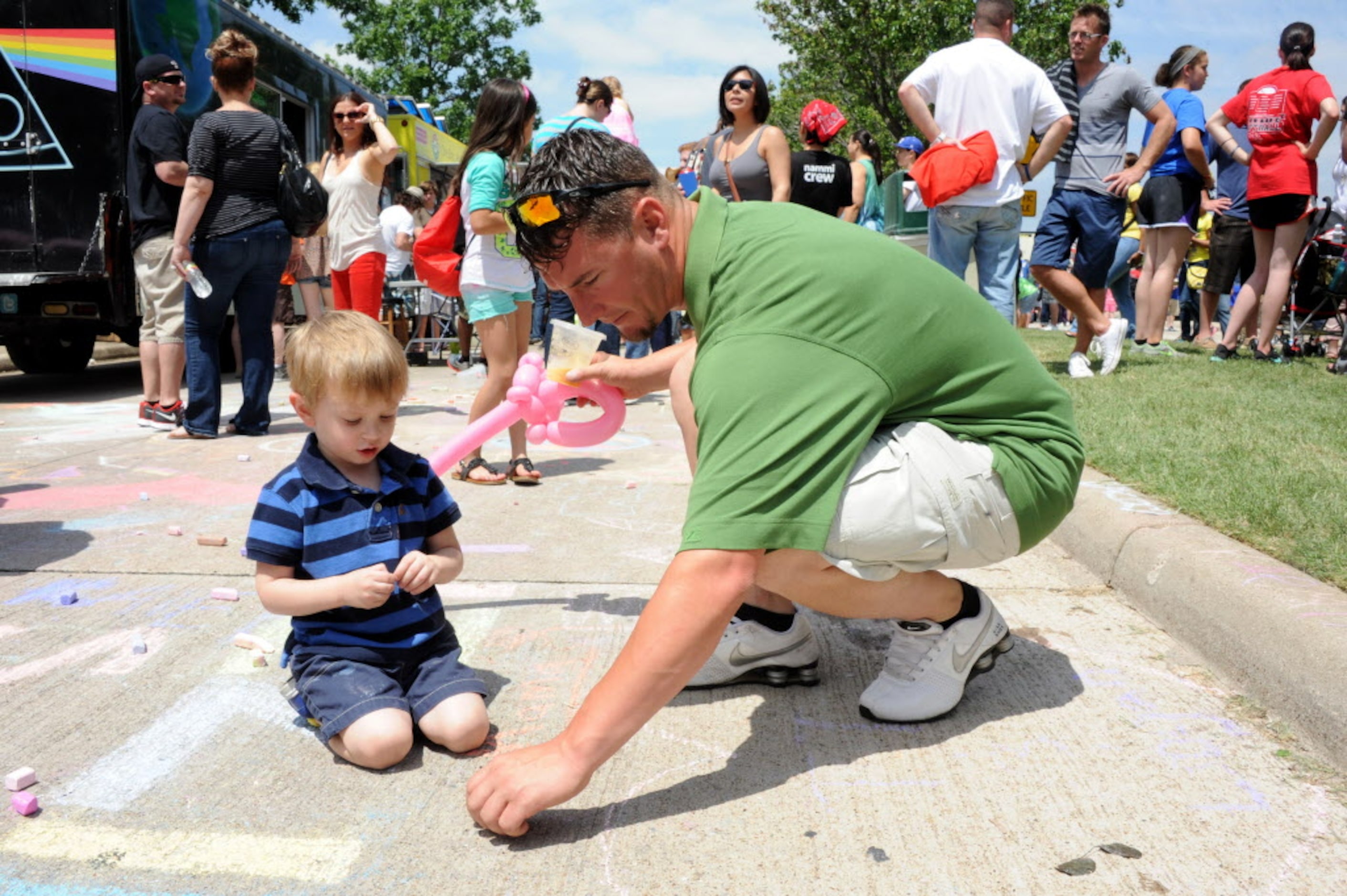 Brandon Toller and son play with chalk drawing two-year-old Brandon Jr.'s favorite cartoon...