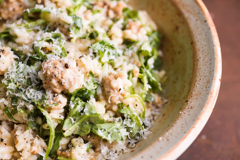 This image released by Milk Street shows a recipe for risotto with sausage. (Milk Street via...