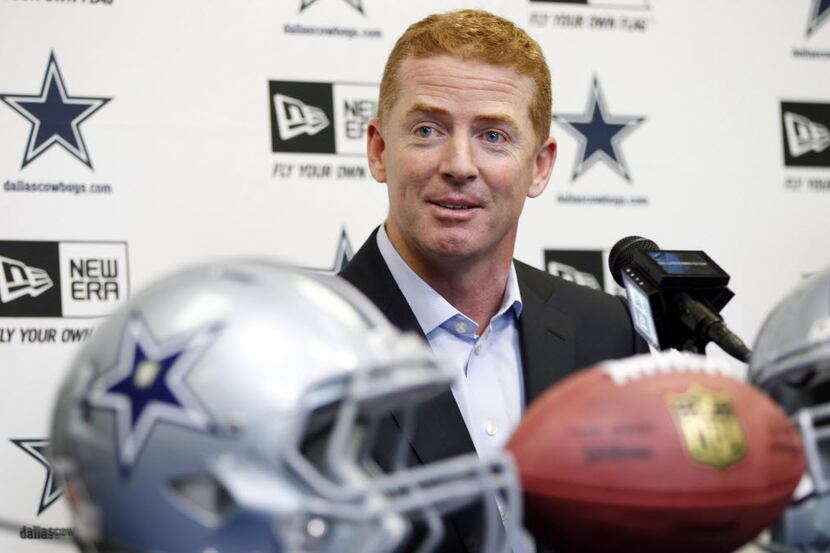 Dallas Cowboys coach Jason Garrett listens to reporters' questions during a news conference...