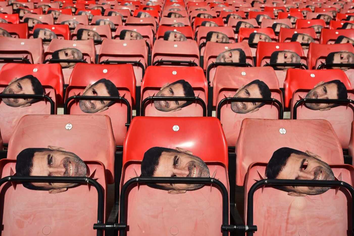 Face masks of former Southampton player Francis Benali are pictured on the seats ahead of...