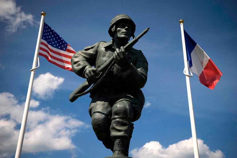 A statue honors the U.S. soldiers of the 82nd Airborne Division near Utah Beach in Normandy,...