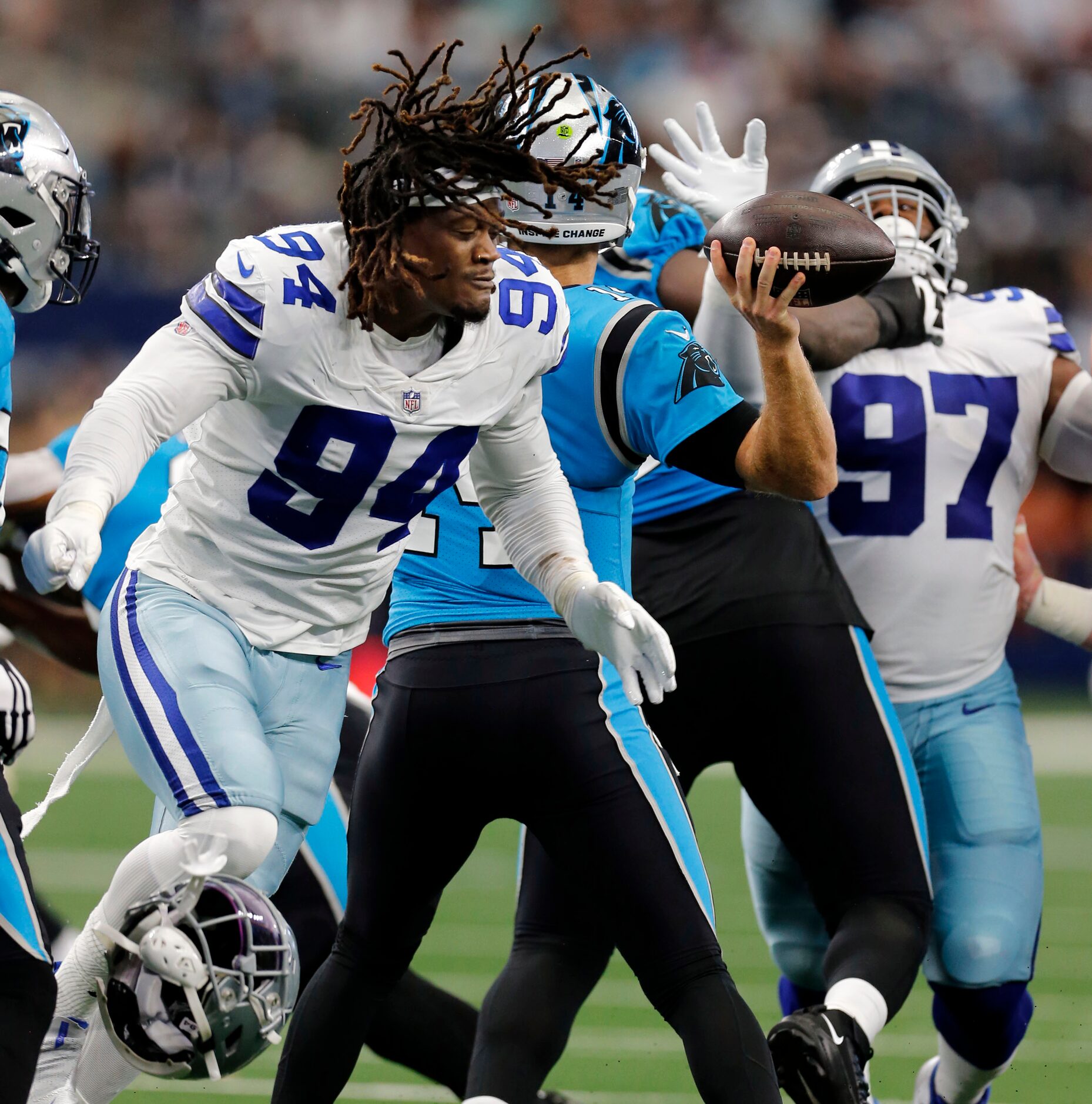 Dallas Cowboys defensive end Randy Gregory (94) has his helmet ripped off, as he rushes...