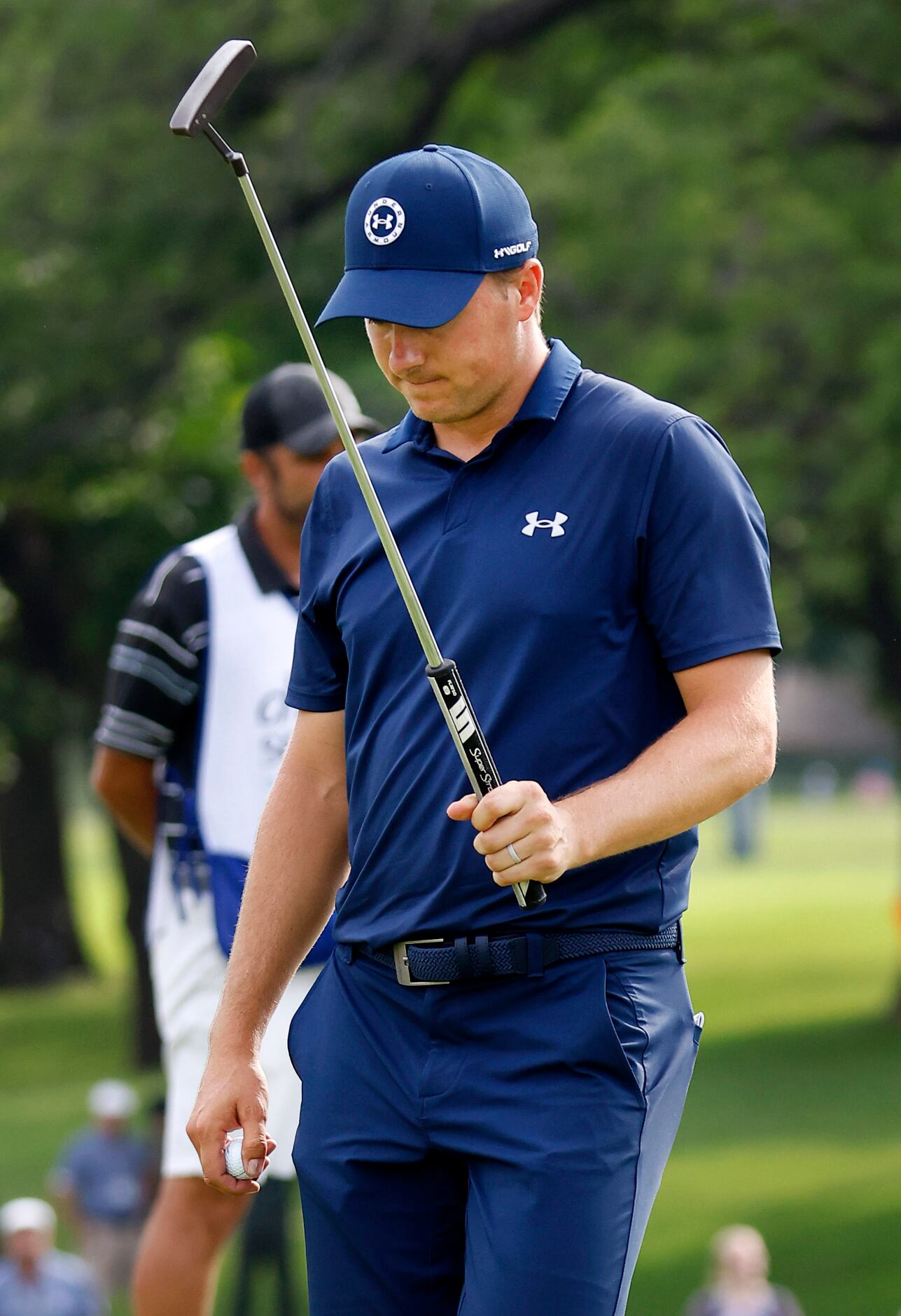 Professional golfer Jordan Spieth reacts after his bogey on No. 18 during the final round of...