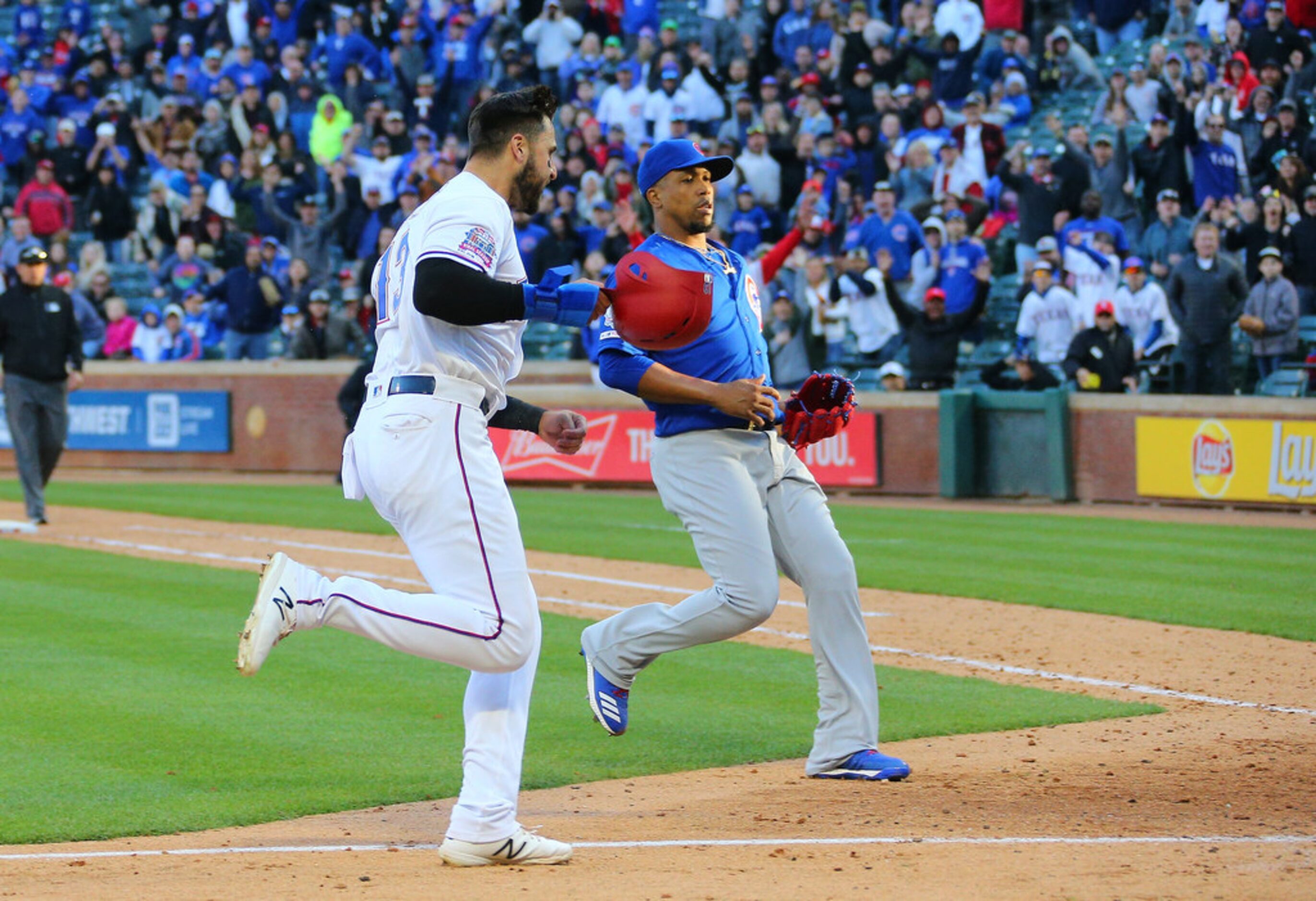 ARLINGTON, TX - MARCH 31: Pedro Strop #46 of the Chicago Cubs looks on as Joey Gallo #13 of...