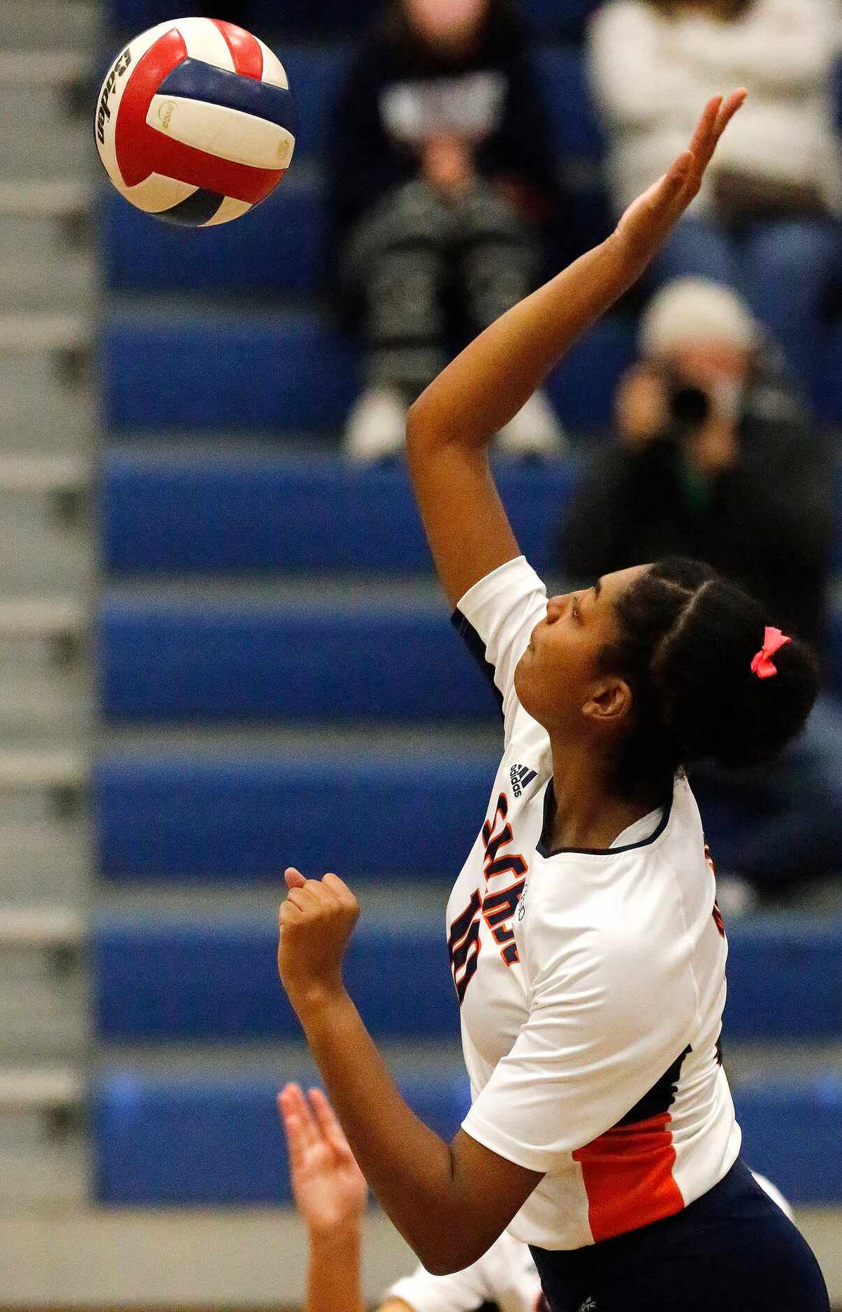 Sachse High School middle blocker Liz Woods (10) spikes the ball during game one as Sachse...