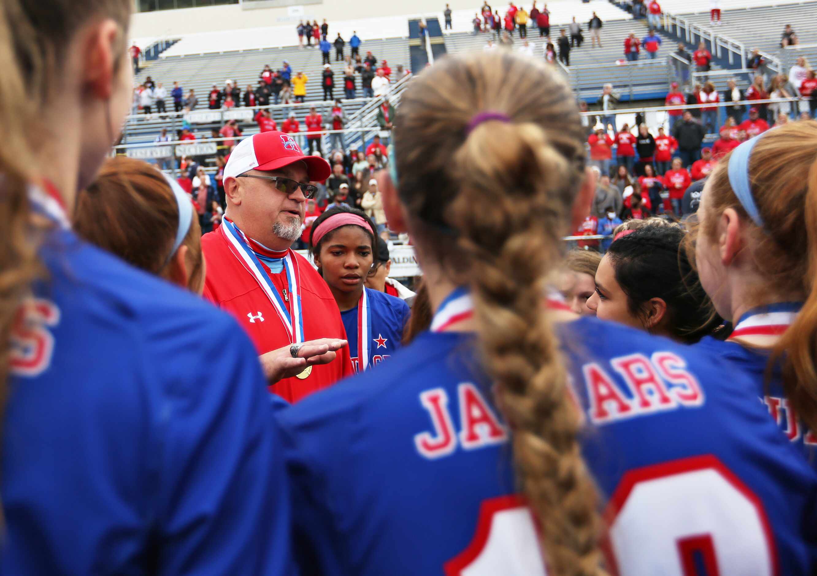 Midlothian Heritage head coach Gerald Slovacek chats with his players at their win over...