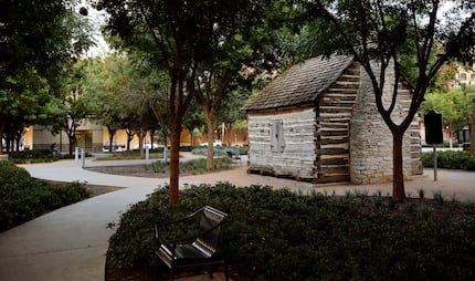 A replica of John Neely Bryan's cabin sits in Founders Plaza on Elm Street. in downtown Dallas.