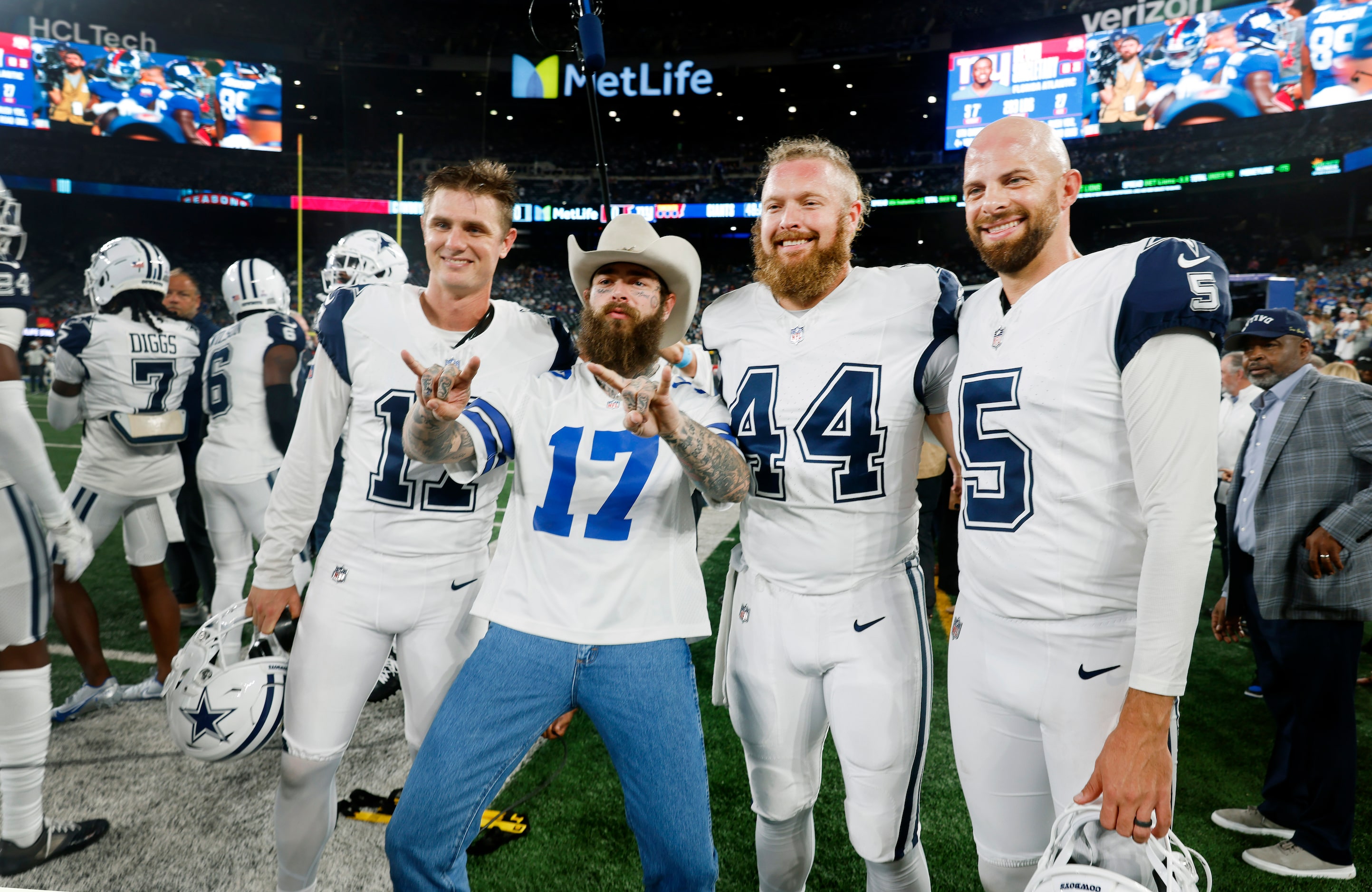 Rapper, singer and songwriter Post Malone (center) poses for a photo with place kicker...