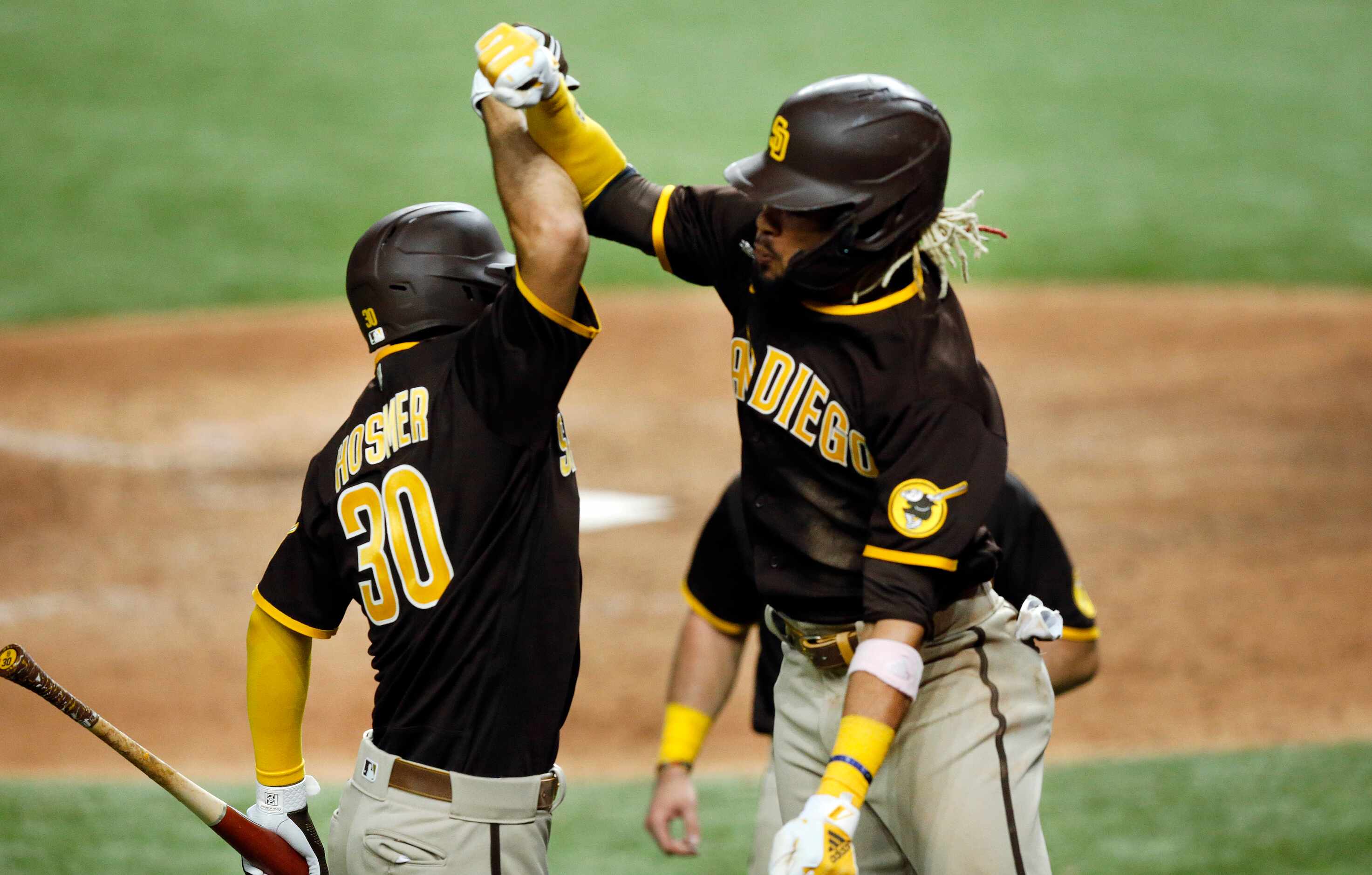 San Diego Padres Fernando Tatis Jr. (right) celebrates his three-run homer with teammate...