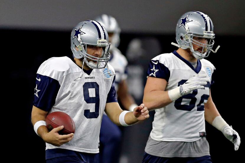 Dallas Cowboys quarterback Tony Romo (9) and tight end Jason Witten warm up during practice...