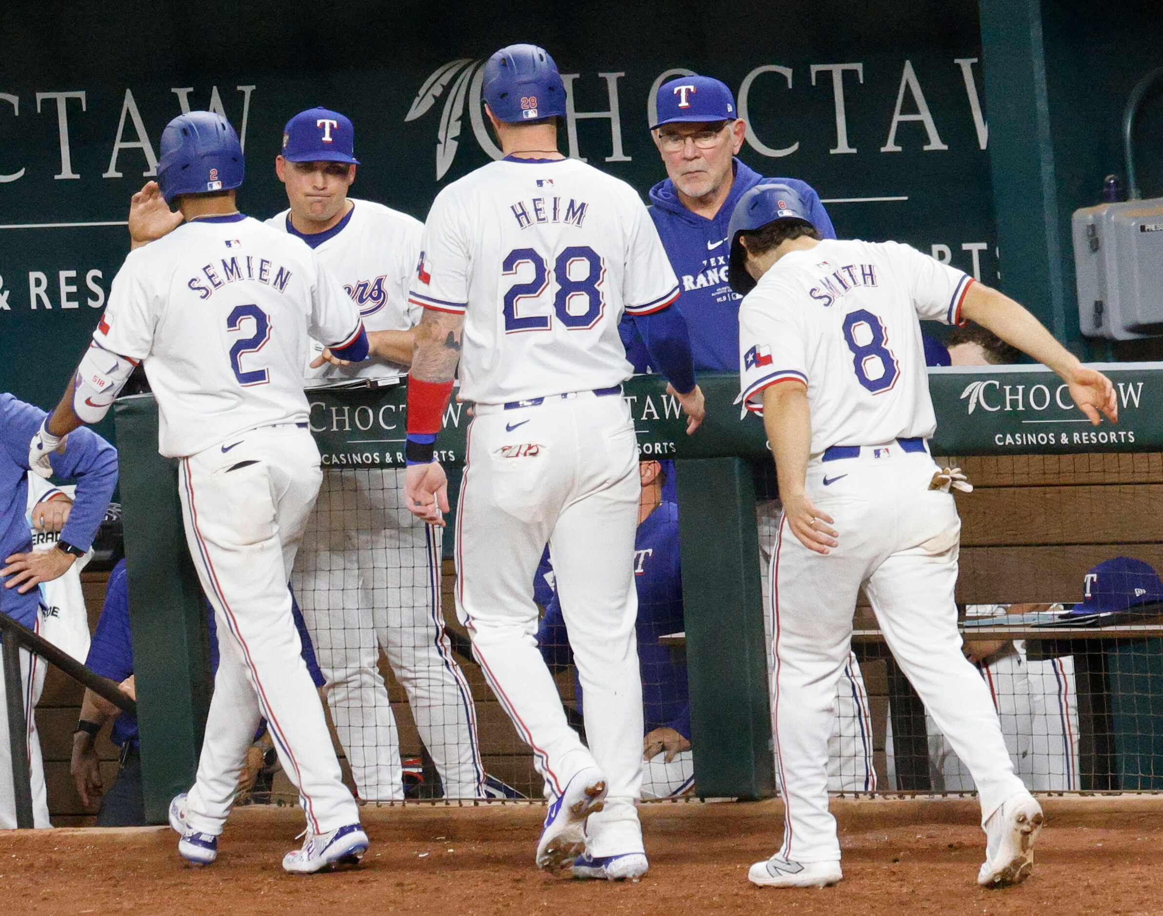 Texas Rangers second base Marcus Semien (2), Texas Rangers catcher 
Jonah Heim, (28) and...