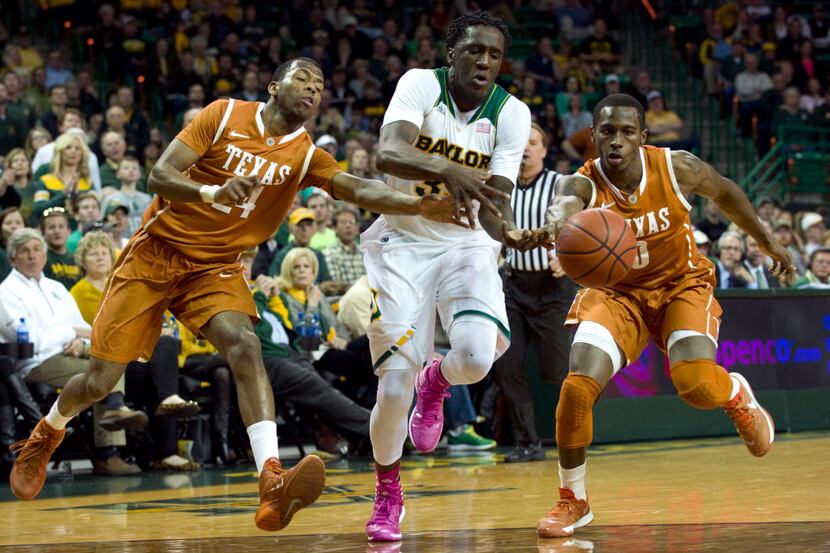 Taurean Prince of the Baylor Bears has the ball knocked away by Martez Walker and Kendal...