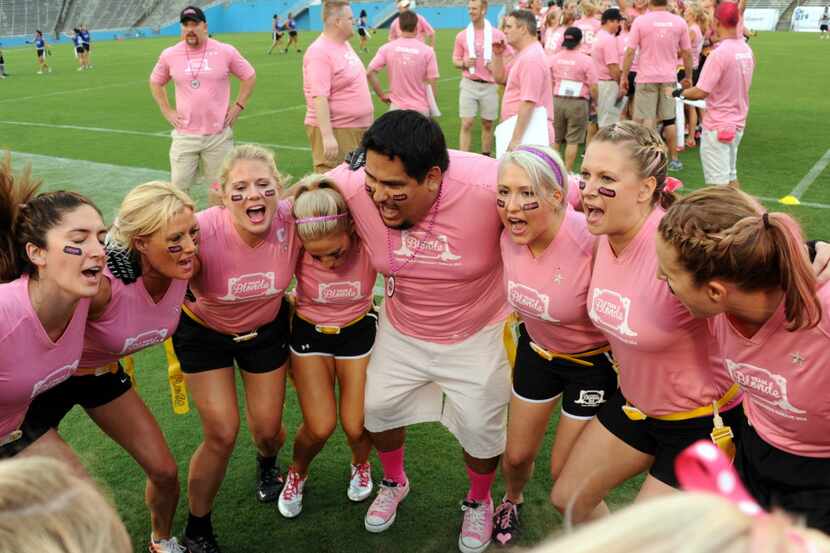 The Blonde team gathered in a huddle for a chant before the 2014 Blondes vs. Brunettes...
