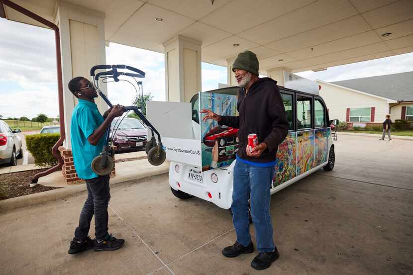 Circuit driver Jakwan Riddick loads a West Dallas senior living resident's rollator into the...