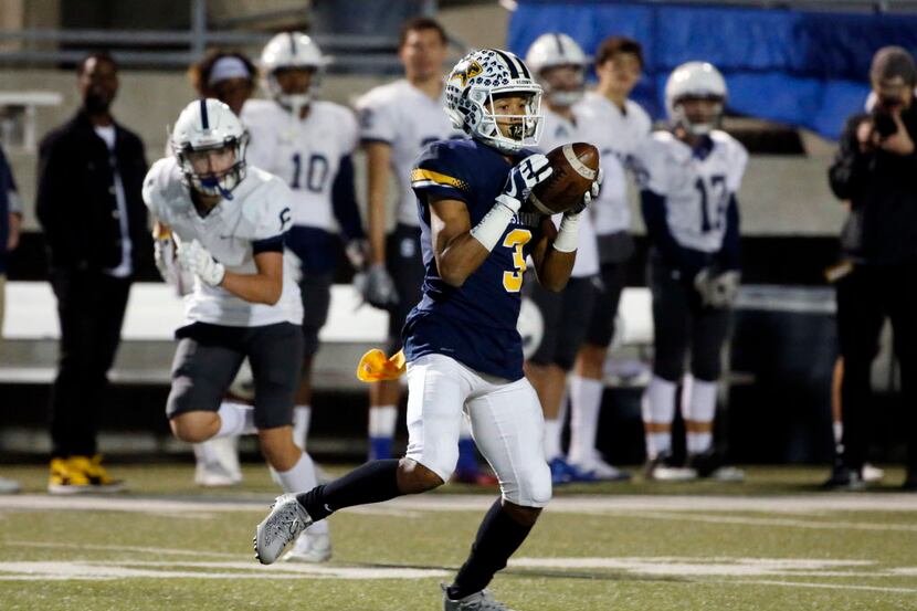 Prestonwood's Ricky Baker (3) catches a pass and scores a touchdown against Fort Worth...