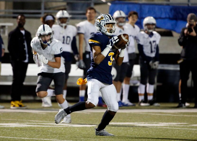 Prestonwood's Ricky Baker (3) catches a pass and scores a touchdown against Fort Worth...