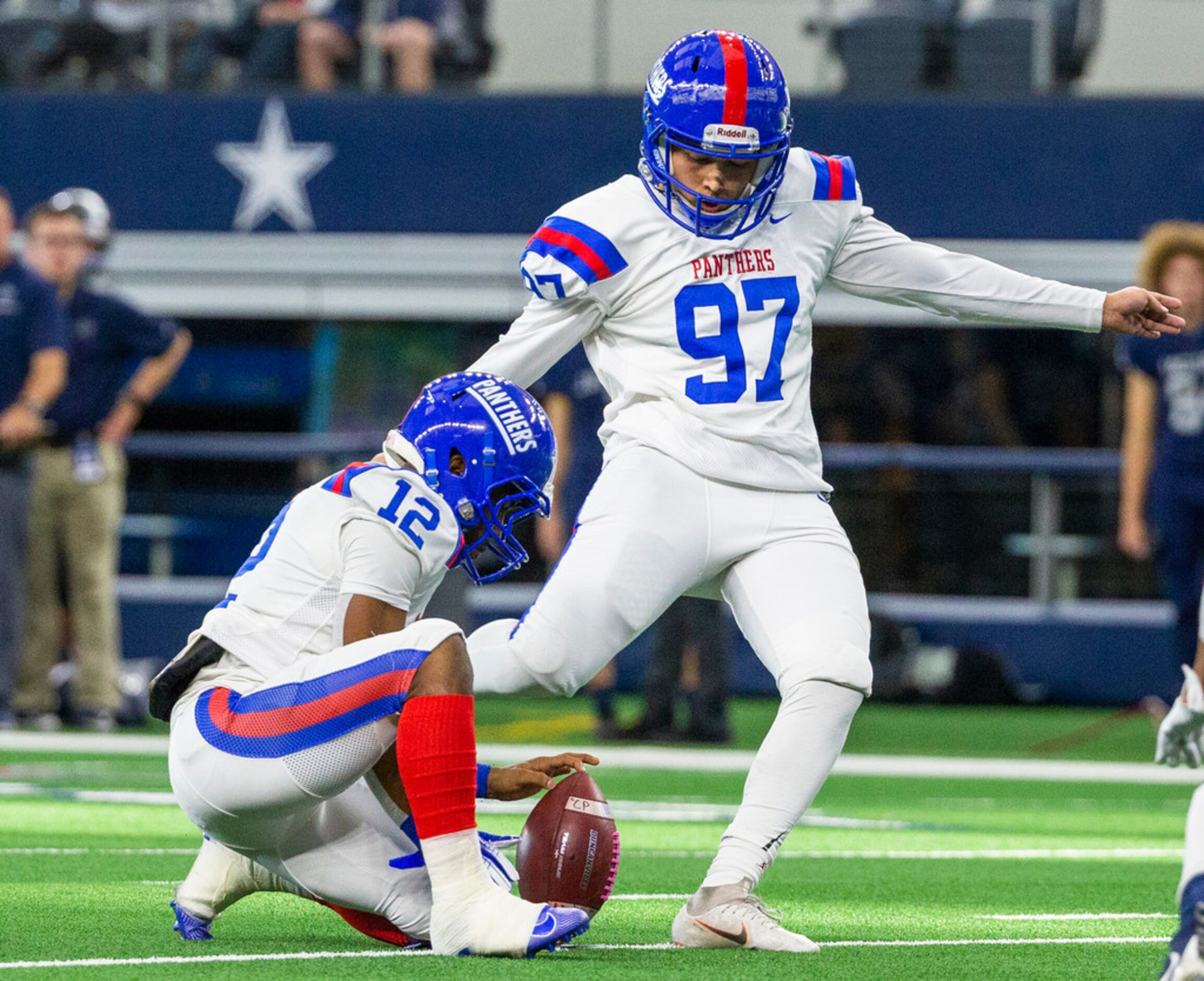 Duncanville kicker Ulises Lara (97) kicks the ball for a field goal against Flower Mound...