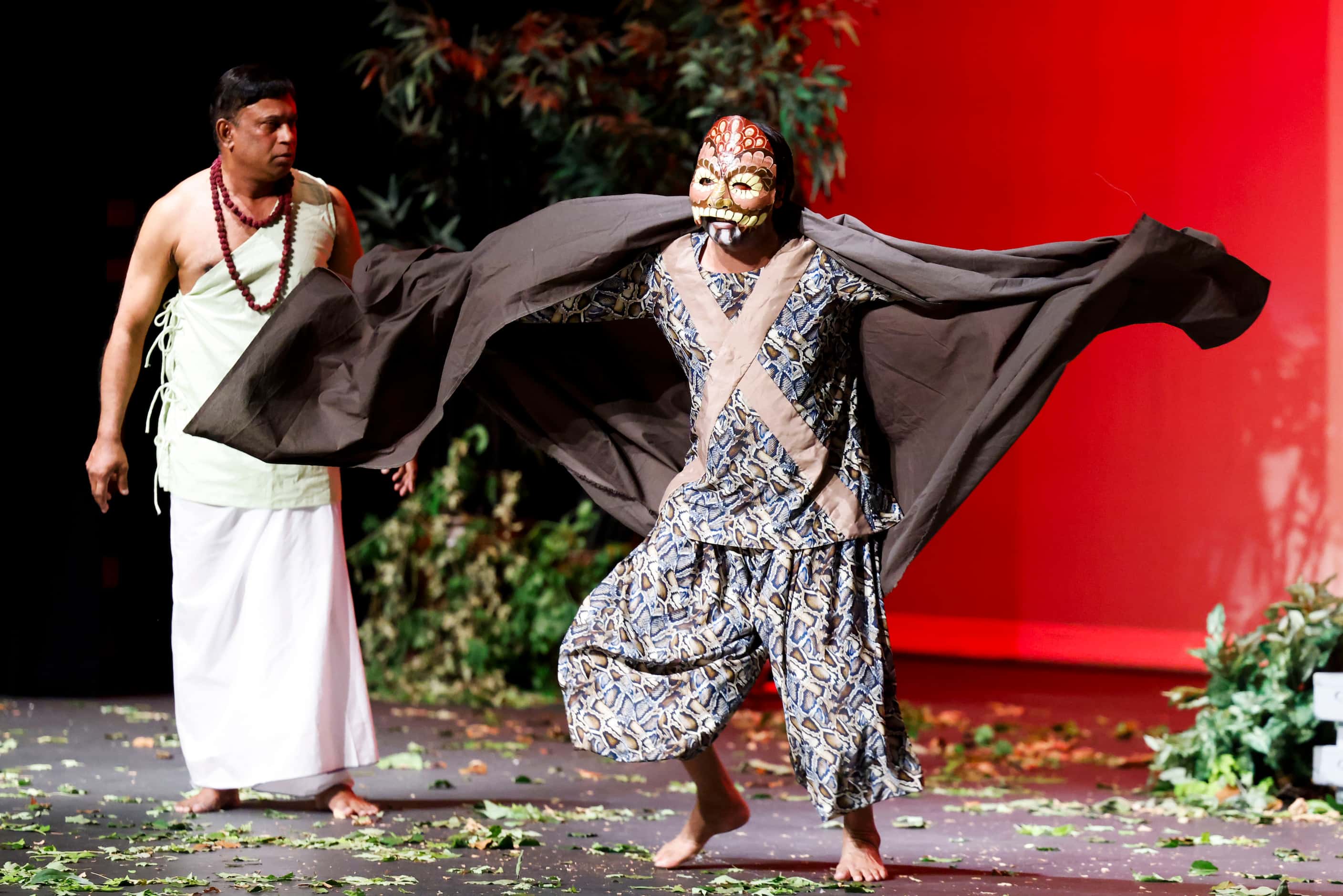 Director and actor Shahiduzzaman Selim (right) acts on his role as Takshak, in the play...