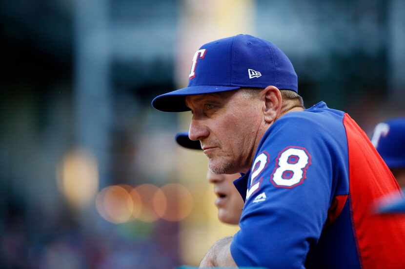 Texas Rangers manager Jeff Banister (28) watches his team play against the Boston Red Sox...
