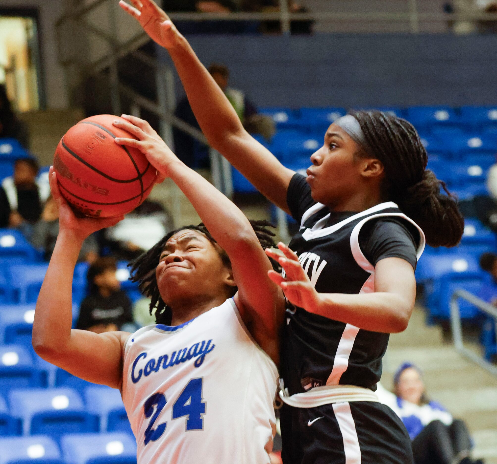 Conway’s Alexis Cox (left) is fouled by Duncanville high’s Kaylinn Kemp during the second...