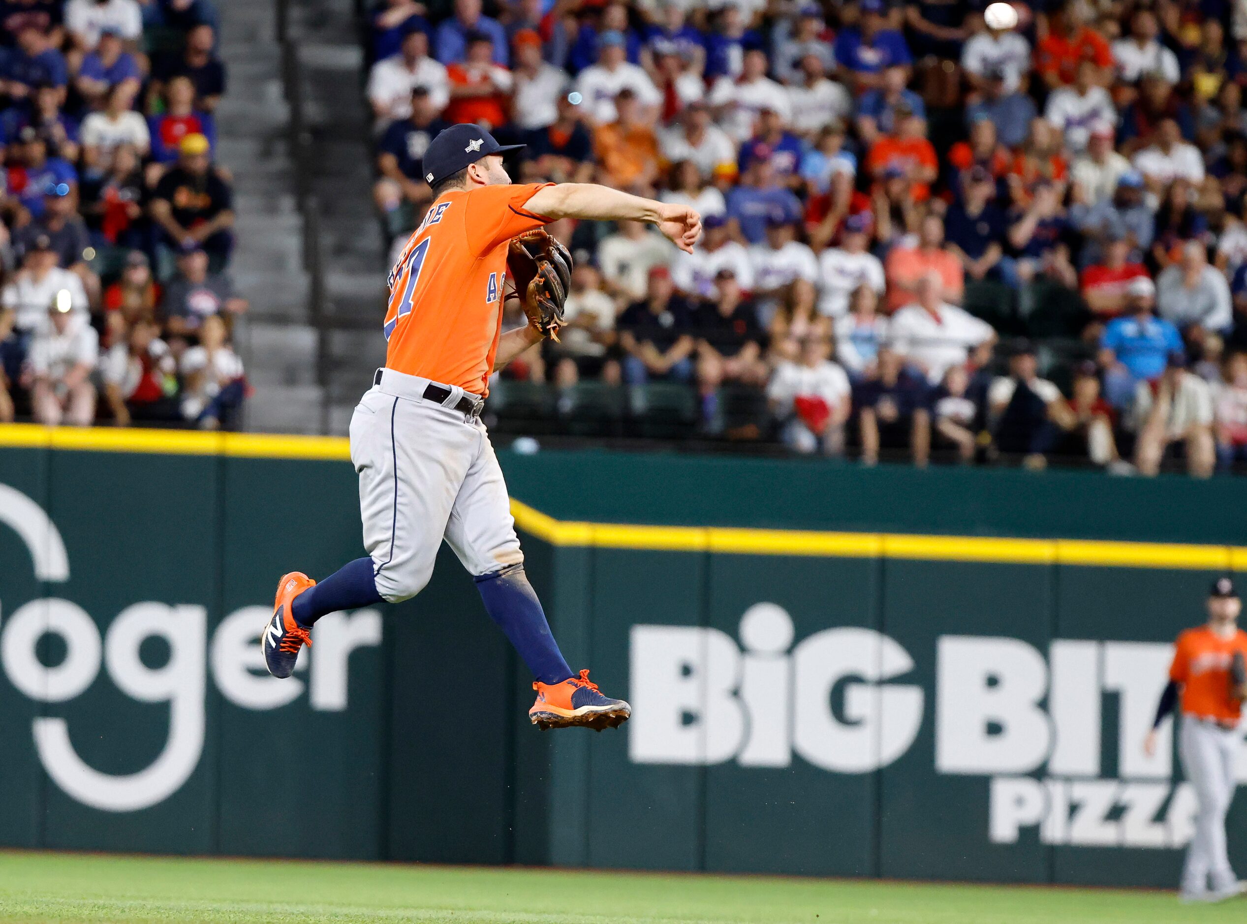 Houston Astros second baseman Jose Altuve (27) throws out Josh Jung during the seventh...