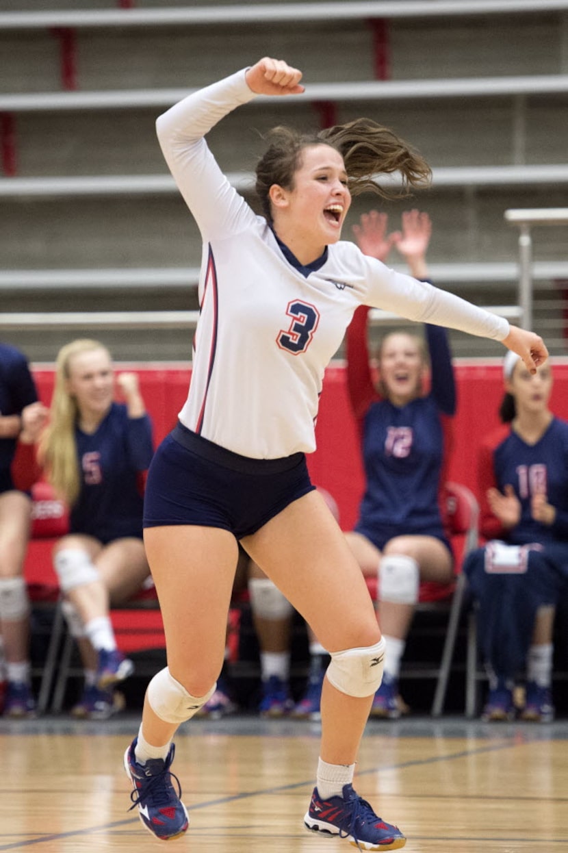 Allen senior libero Shelby Perlich celebrates a point against Southlake Carroll during their...