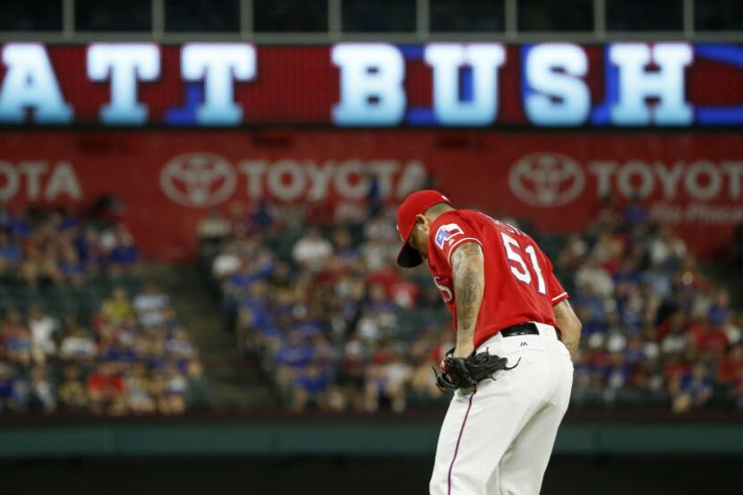 Texas Rangers relief pitcher Matt Bush gets ready to pitch against Oakland Athletics during...