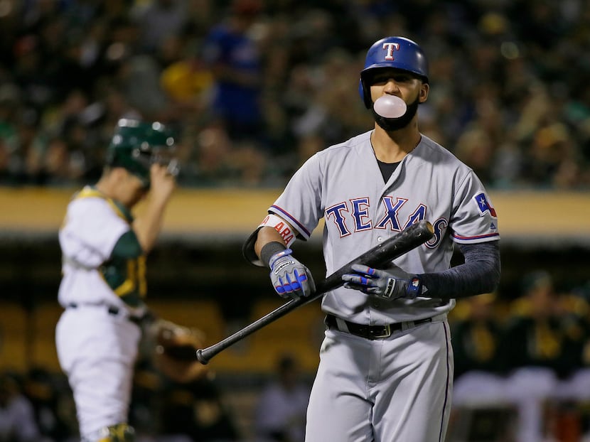 Texas Rangers' Nomar Mazara walks back to the dugout after striking out swinging against...