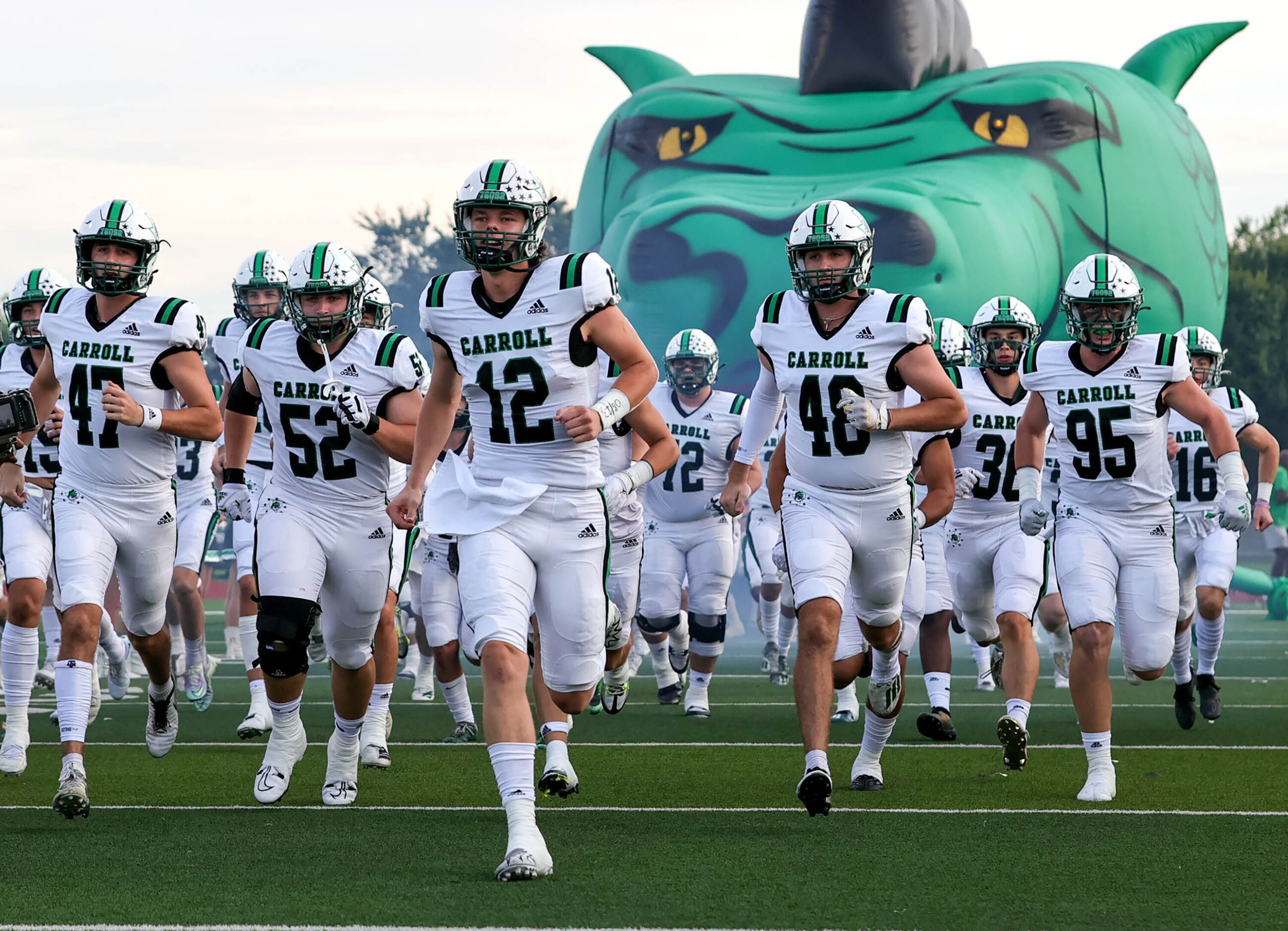 The Southlake Carroll Dragons enter the field to face Flower Mound Marcus in a high school...