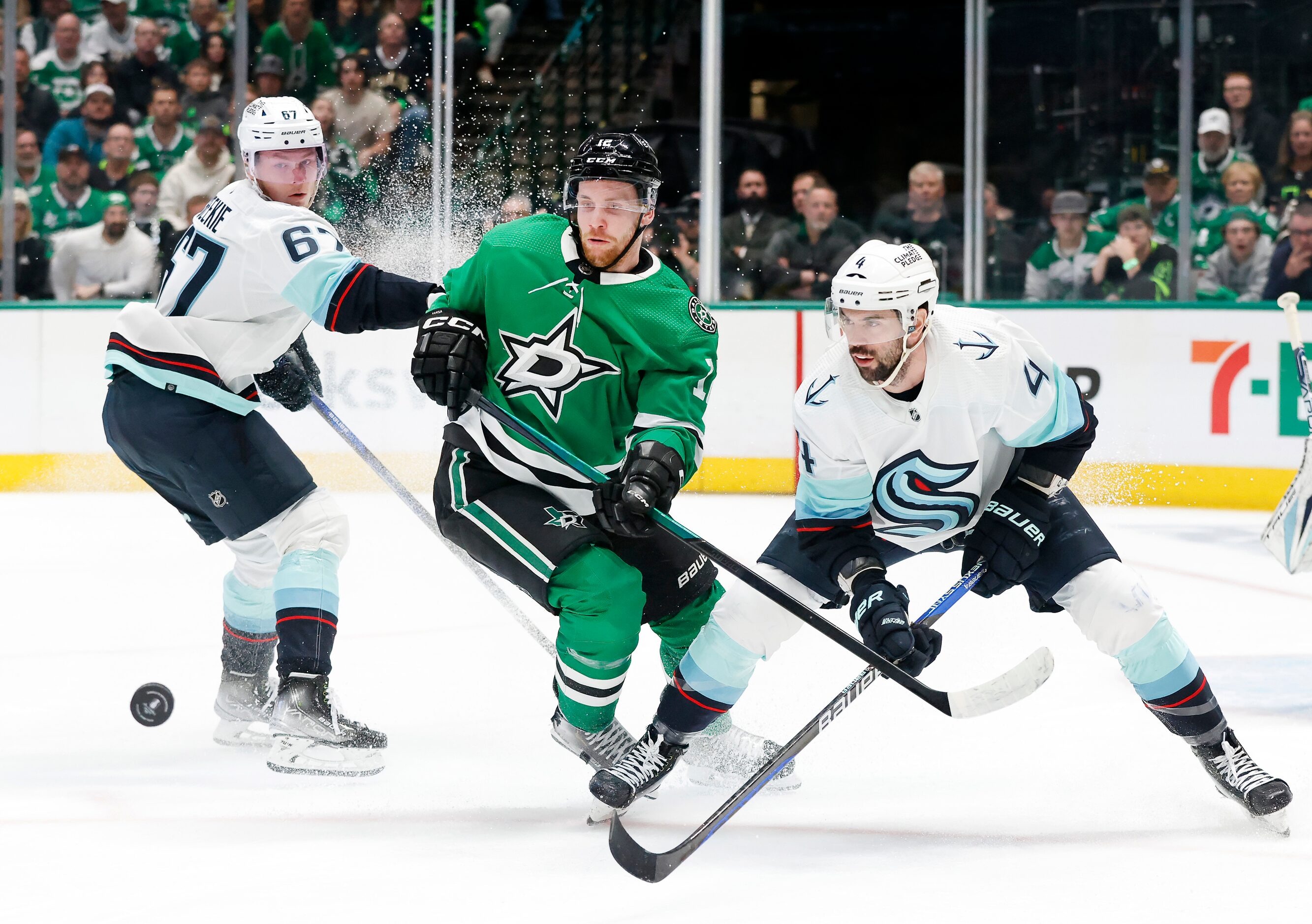 Dallas Stars center Radek Faksa (12) has the puck taken by Seattle Kraken defenseman Justin...