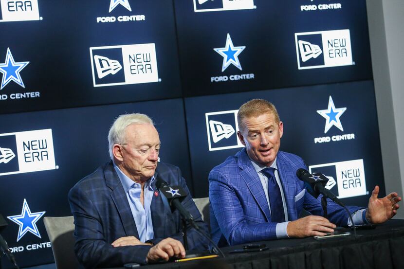 Dallas Cowboys owner Jerry Jones, left, and head coach Jason Garrett speak to reporters...