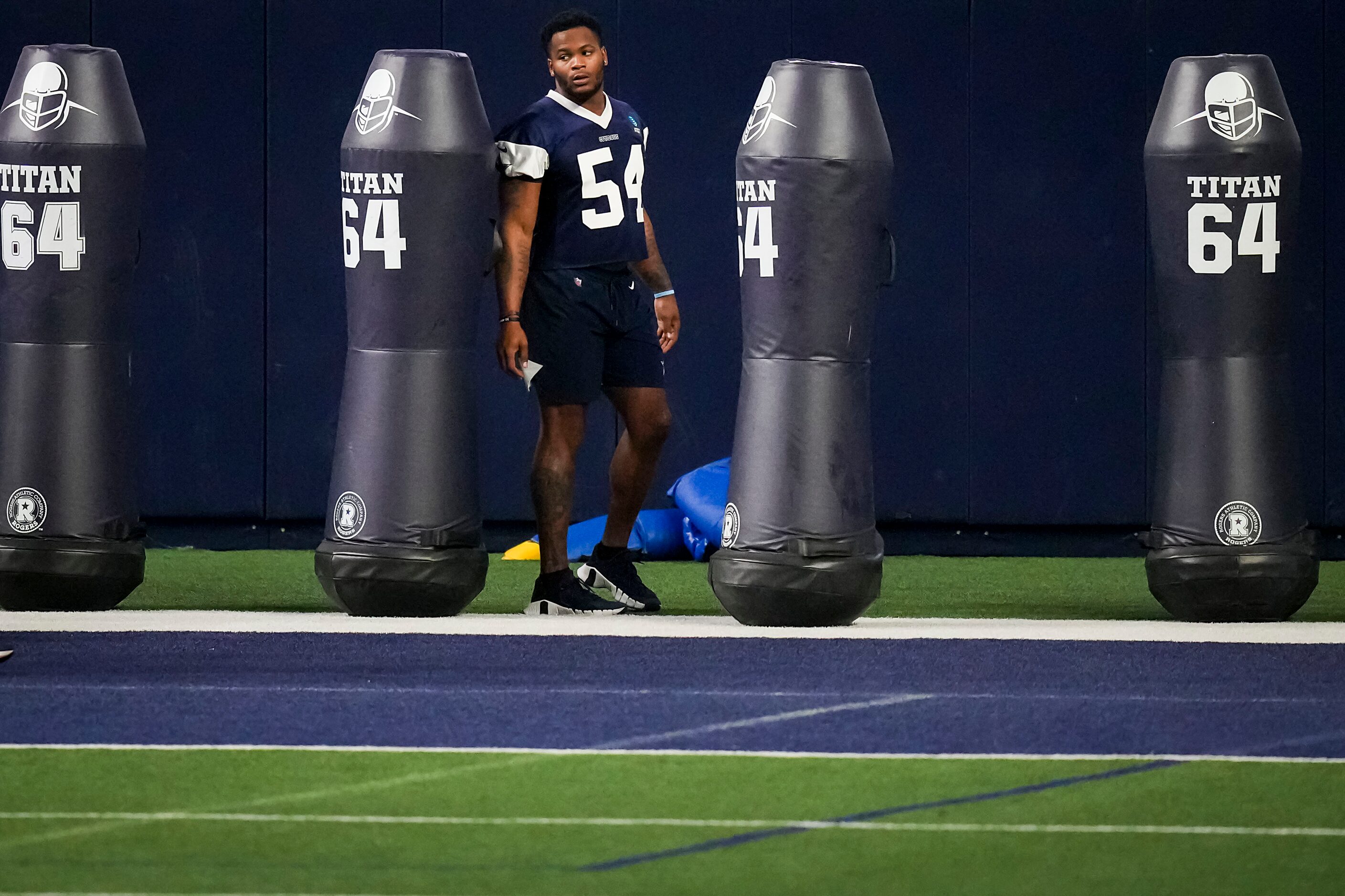 Dallas Cowboys defensive end Sam Williams watches teammates run a drill during the OTA...