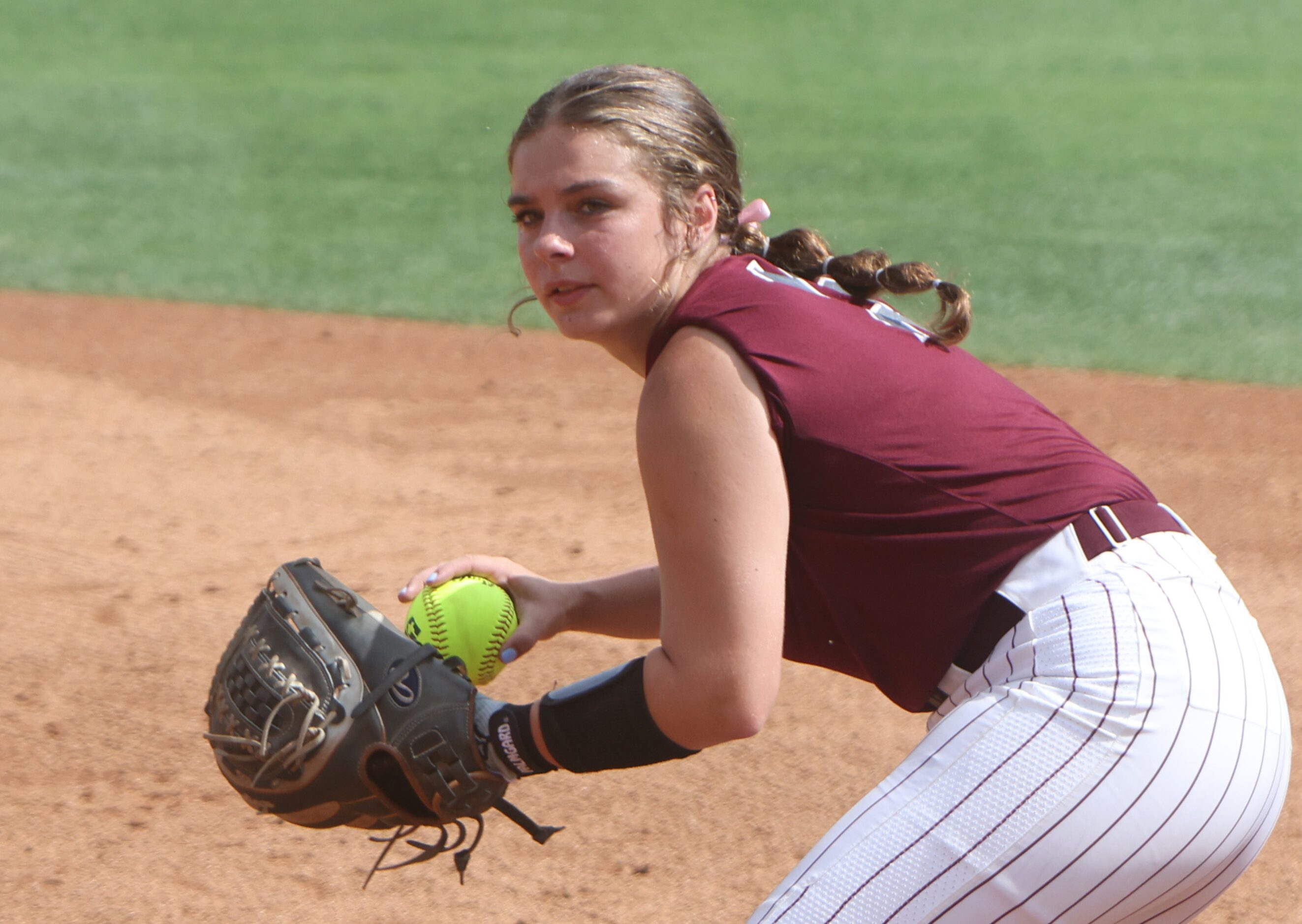 Frisco Heritage second baseman Maddison Young (2) fields a ground ball during the bottom of...