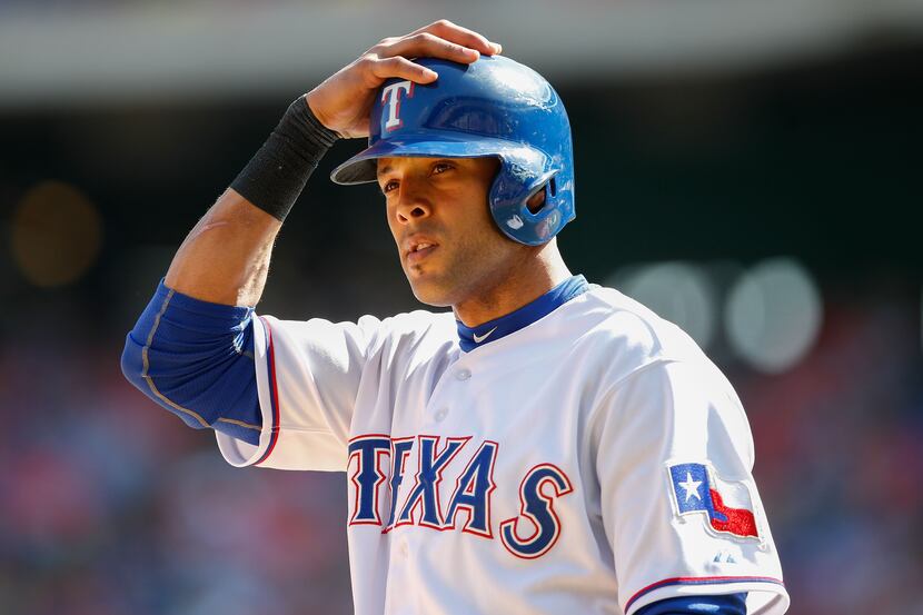 May 18, 2014; Arlington, TX, USA; Texas Rangers right fielder Alex Rios (51) reacts during...