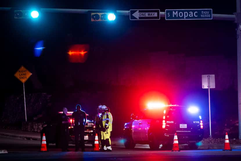 Austin Police officers close La Crosse Avenue near Mopac Expressway in Austin, Texas late...