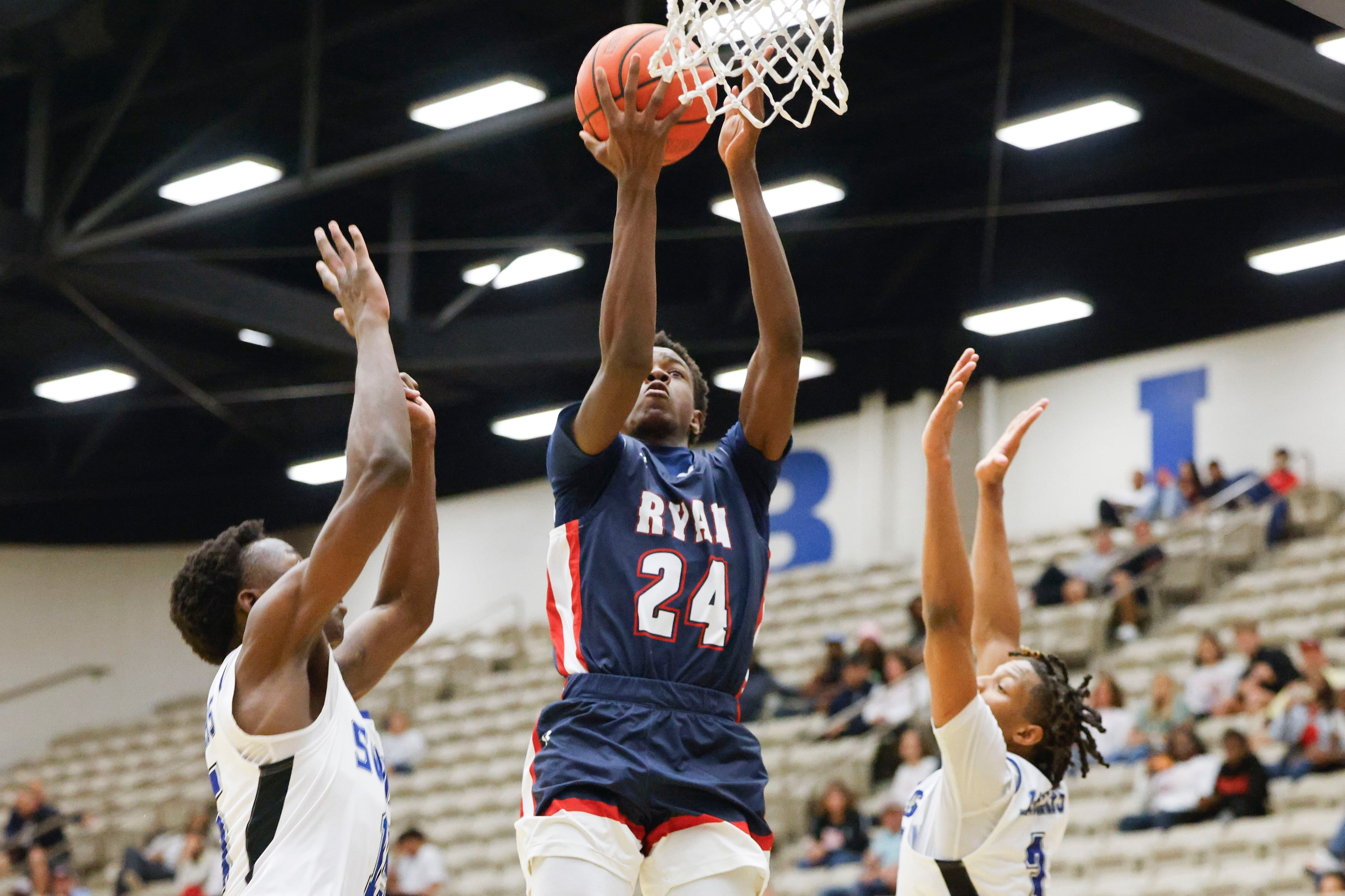 Mansfield Summit’s Ian Sedah (left) attempt to reach as Denton Ryan’s Xavier Hiler drives to...