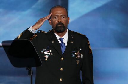 Milwaukee County Sheriff David Clarke Jr. salutes the crowd prior to delivering a speech on...