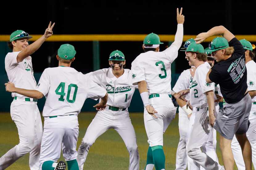 Southlake Carroll players celebrate after winning the Class 6A Region I final series at The...