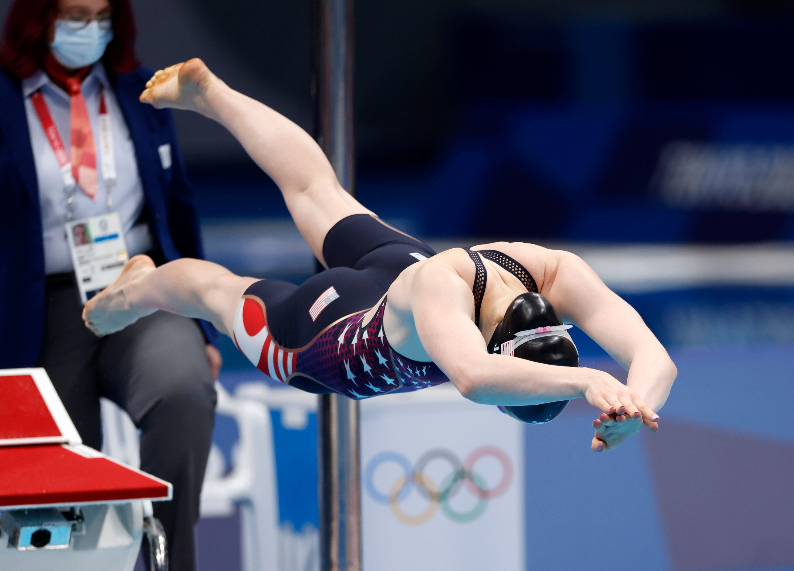 USA’s Lydia Jacoby dives in as she competes in the women’s 100 meter breaststroke final...