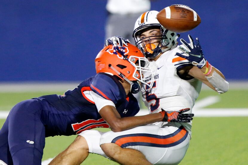 Wakeland High School wide receiver Kevin Rachel (5) appeared to have made a juggling catch...