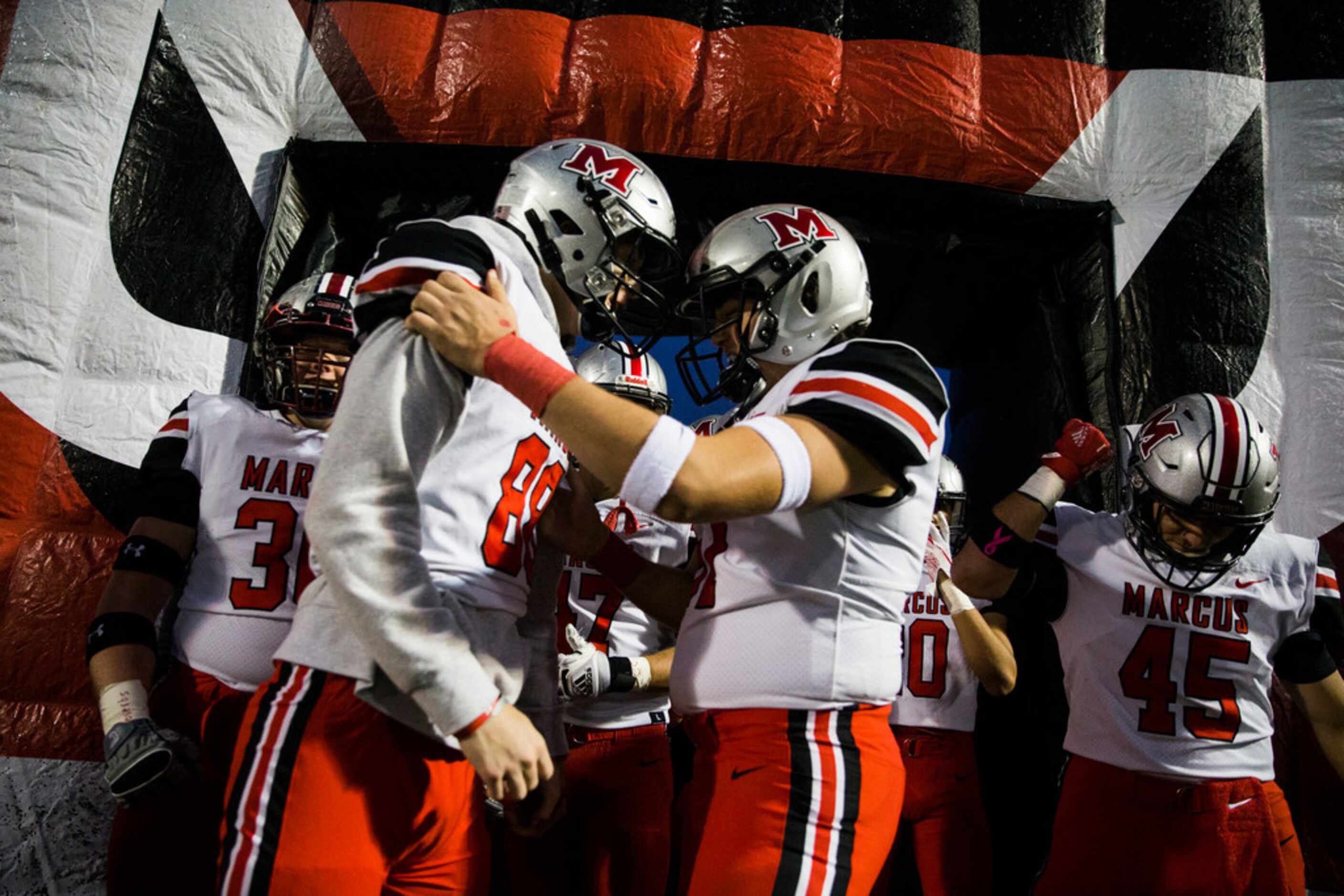 Flower Mound Marcus players get hyped up before a District 6-6A high school football game...