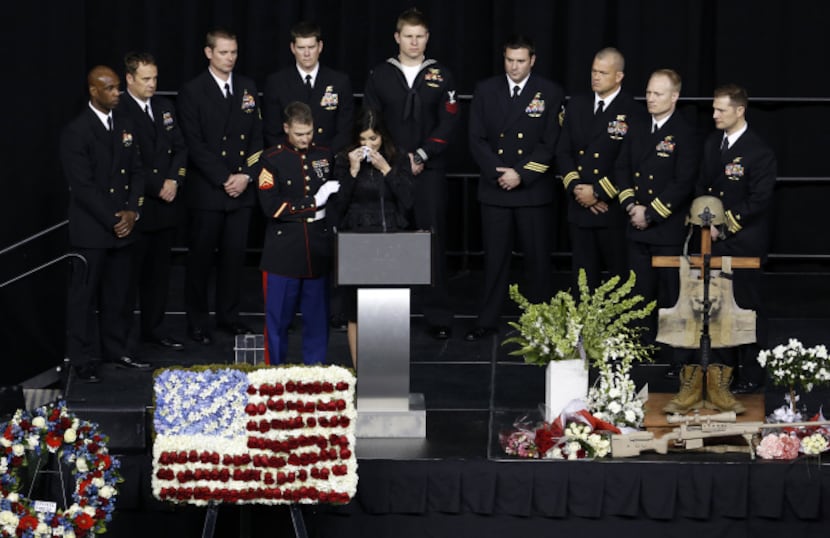 Taya Kyle, wife of former Navy SEAL Chris Kyle wipes her face the during memorial service on...