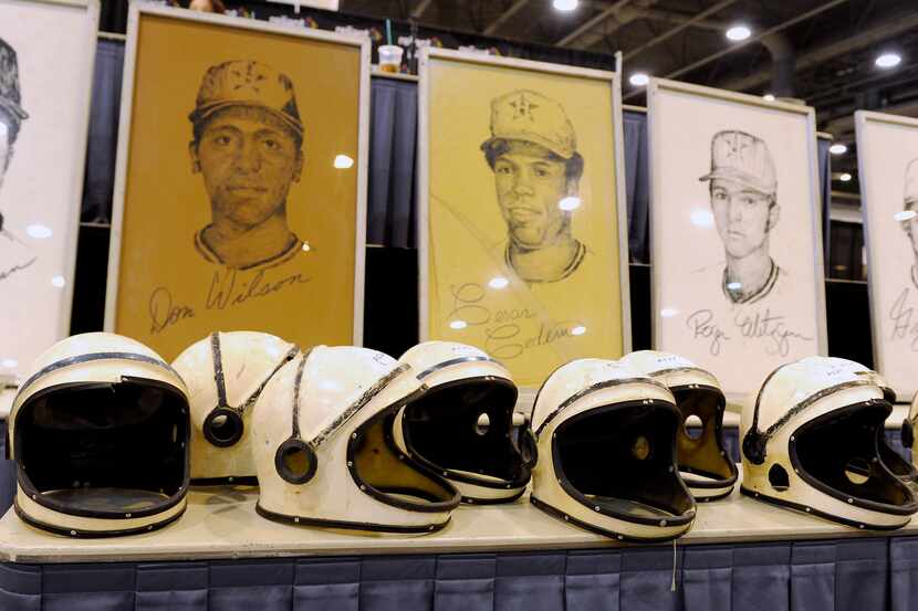 Space helmets worn by the grounds crew in the early years of the Houston Astrodome are lined...