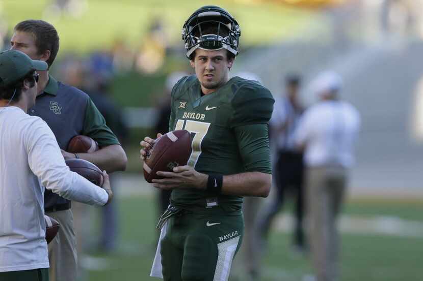 Baylor quarterback Seth Russell (17) warms up before an NCAA college football game against...