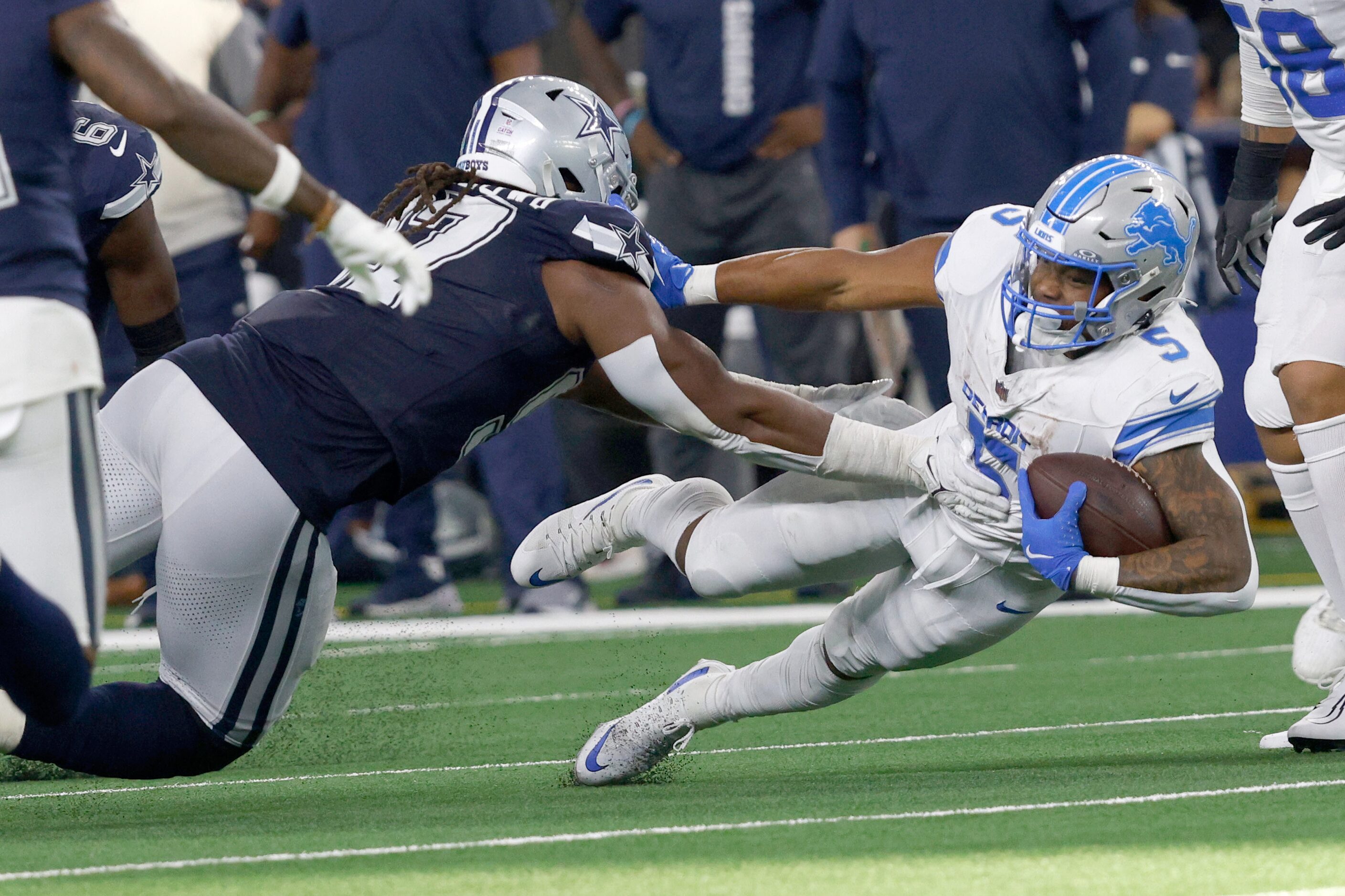 Detroit Lions running back David Montgomery (5) is tackled by Dallas Cowboys defensive...