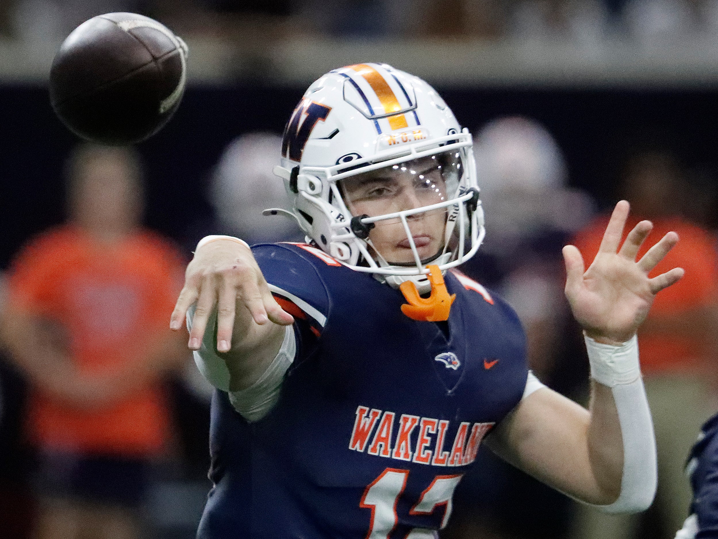 Wakeland High School quarterback Jayden Maples (12) throws a pass during the first half as...